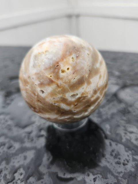 Brown and white sparkling agate sphere 11 ounces