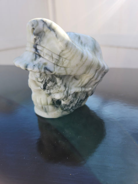 Tree agate skull with a hat carving