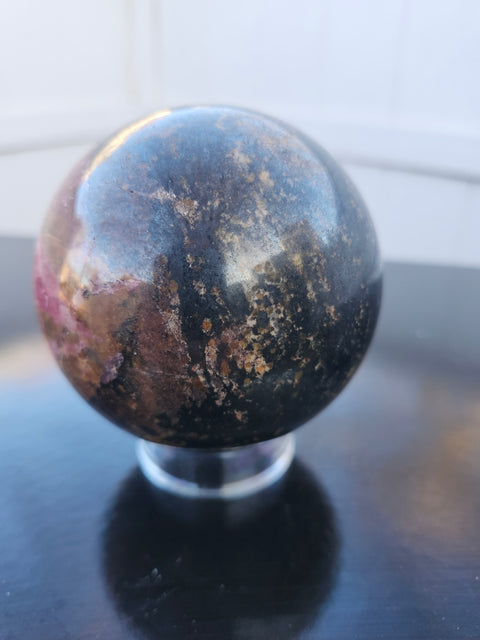 Rhodonite sphere with stand