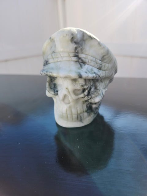 Tree agate skull with a hat carving