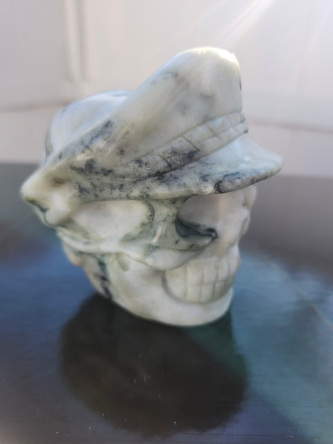 Tree agate skull with a hat carving