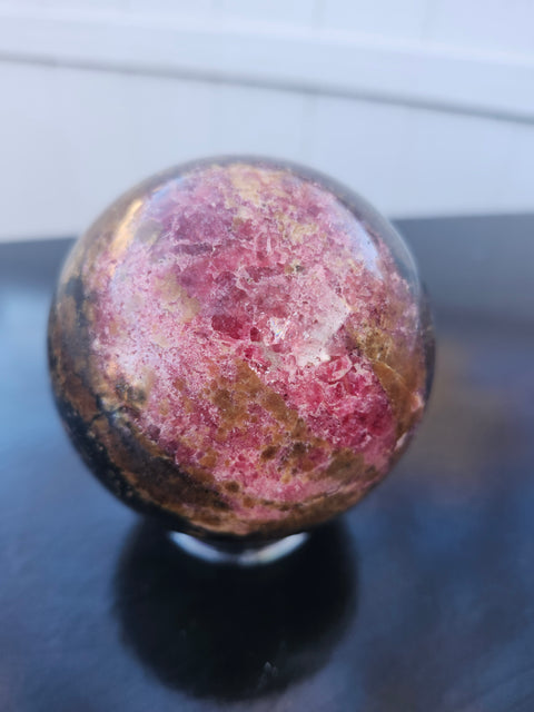 Rhodonite sphere with stand